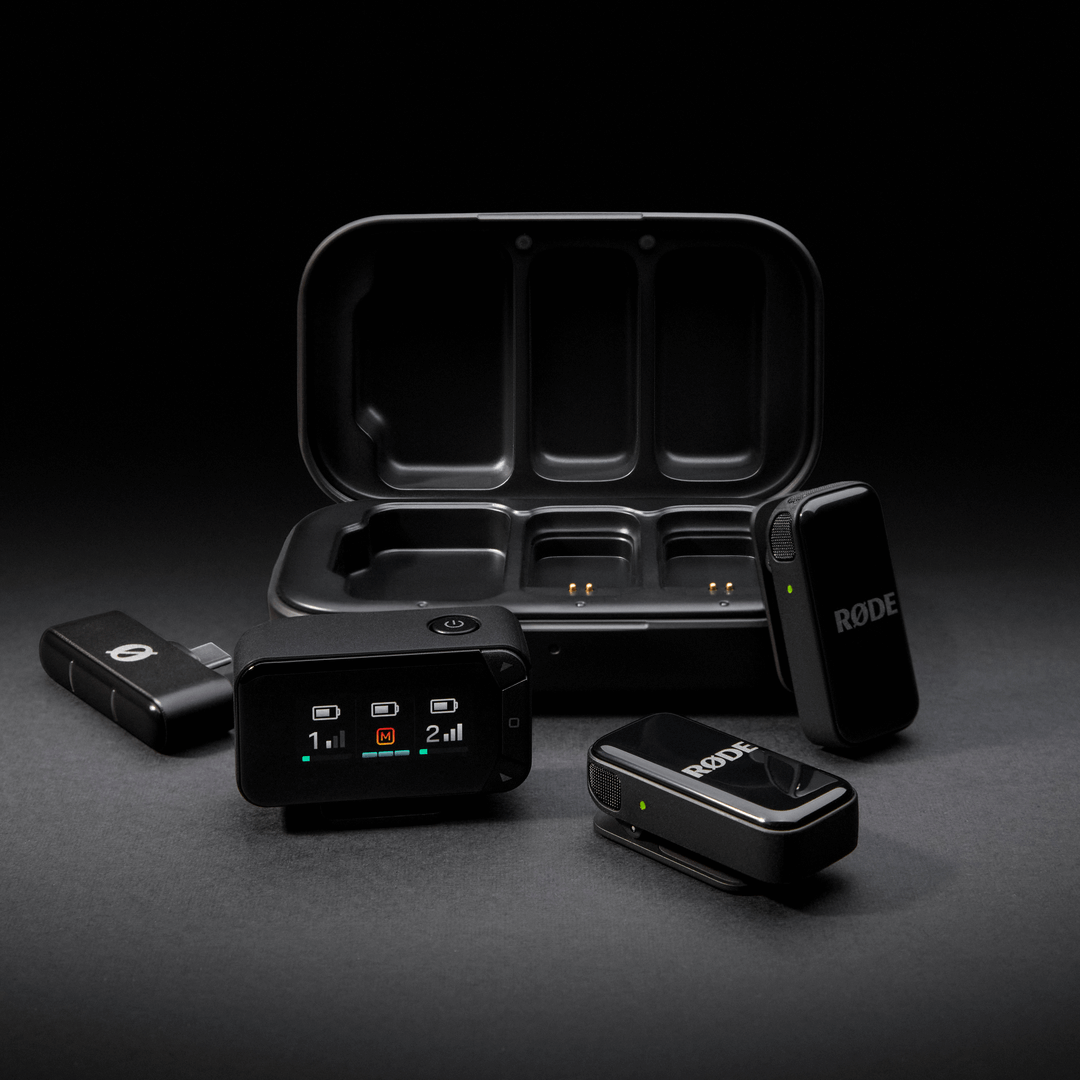 Wireless Microphone Camera kit arranged around the charging case