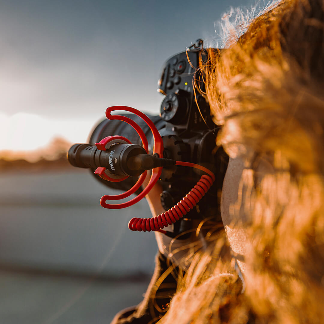 Pic of someone using a VideoMicro on a camera