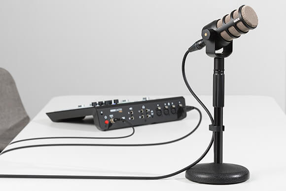 PodMic connected to back of RØDECaster Pro via XLR cable