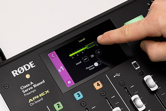 Finger adjusting gain for microphone channel 1 on RØDECaster Pro