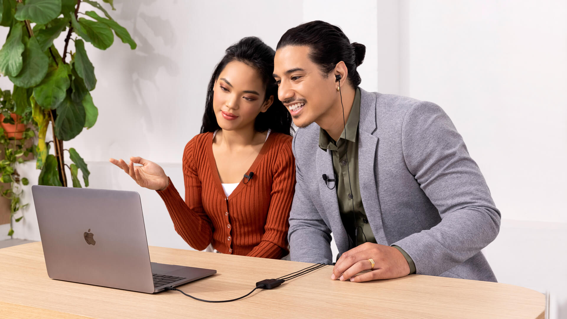 Couple doing video call on MacBook using AI-Micro and Lavalier II