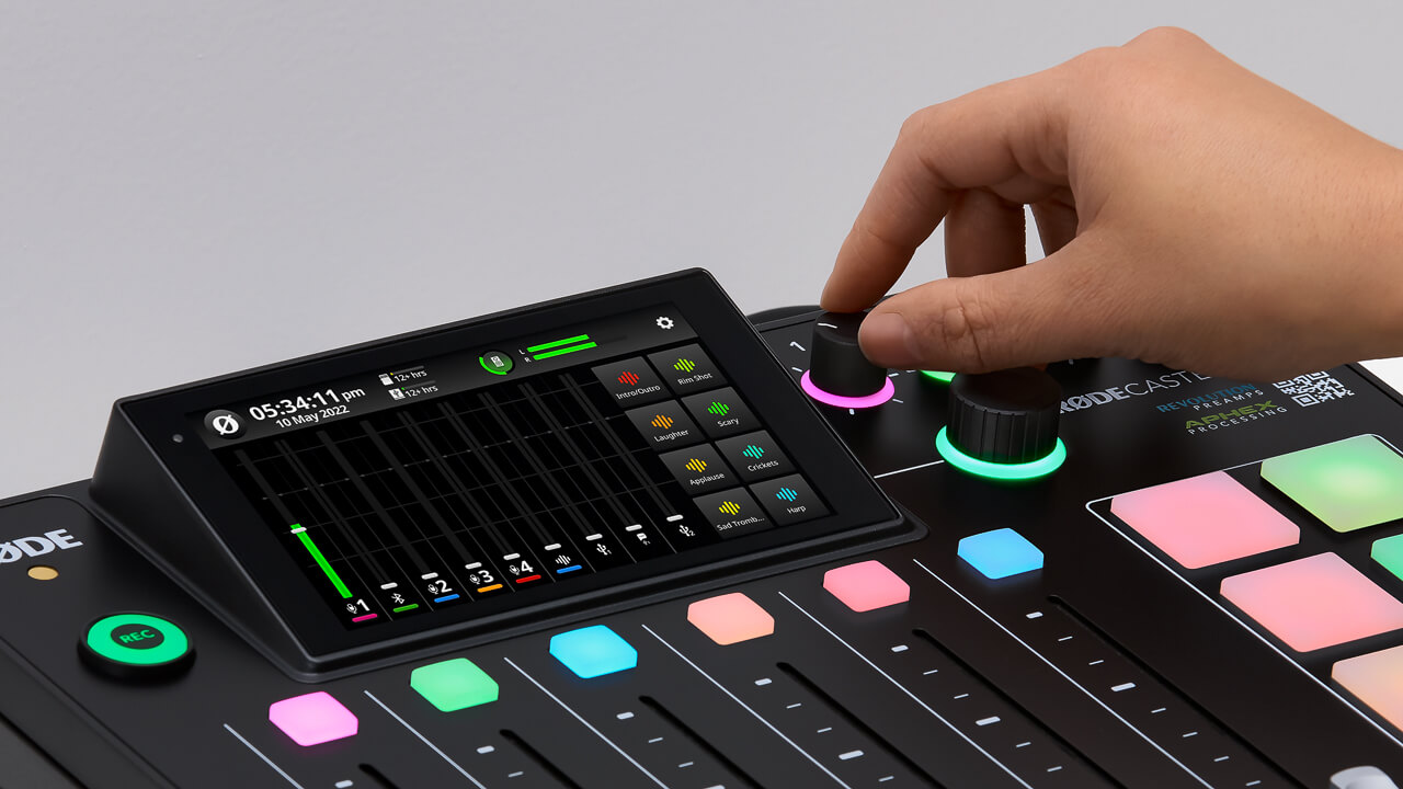 Hand adjusting RØDECaster Pro II headphone levels knob