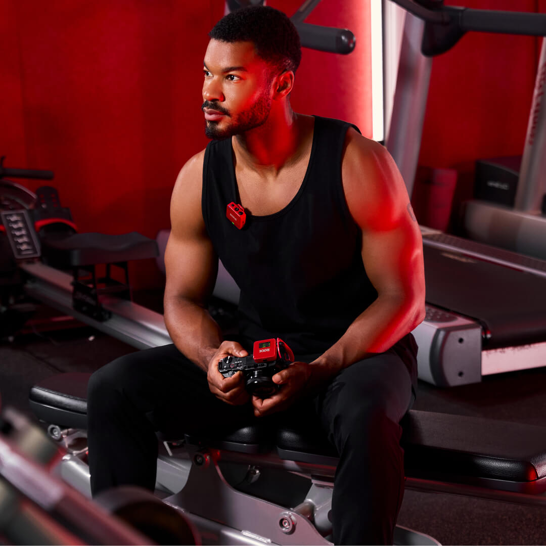 Man using red Wireless GO (Gen 3) for fitness content