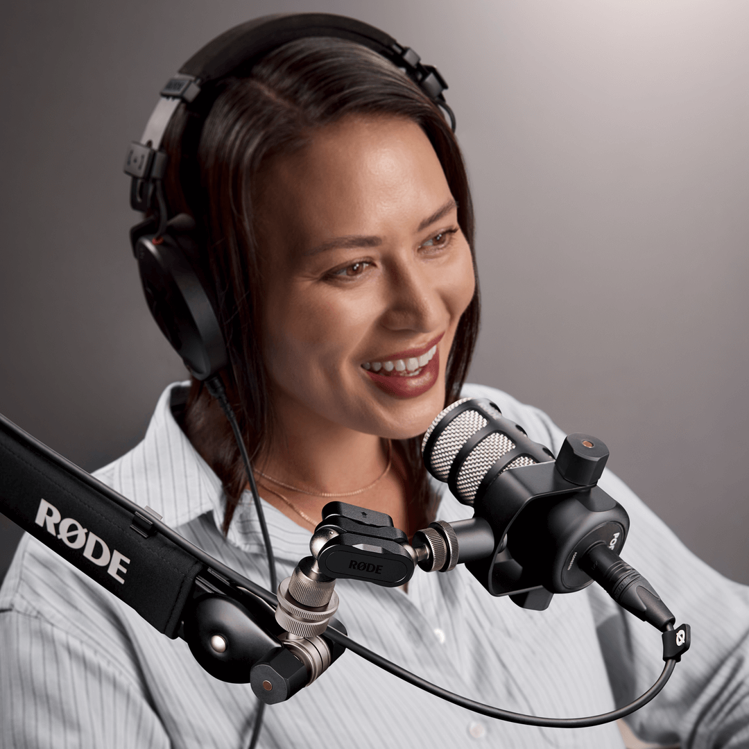 Person speaking into microphone mounted on Universal Ball Mount